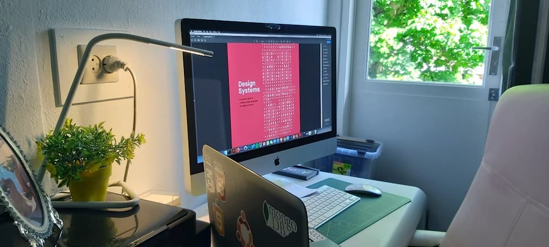 Apple iMac displaying design system in creative web design studio