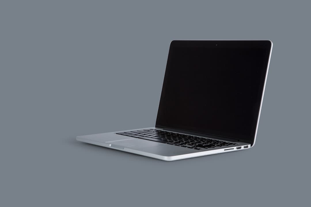 SaaS founder building a Framer marketing site on a laptop