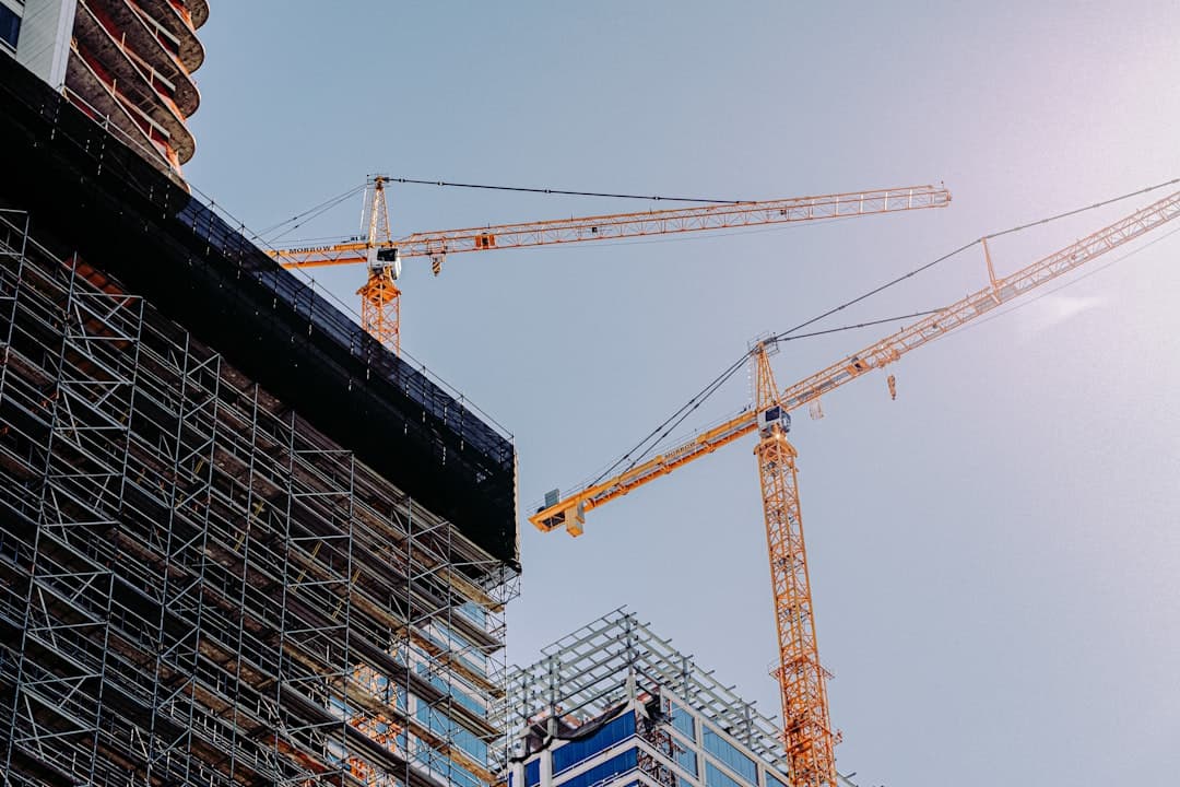 Construction site with cranes and building