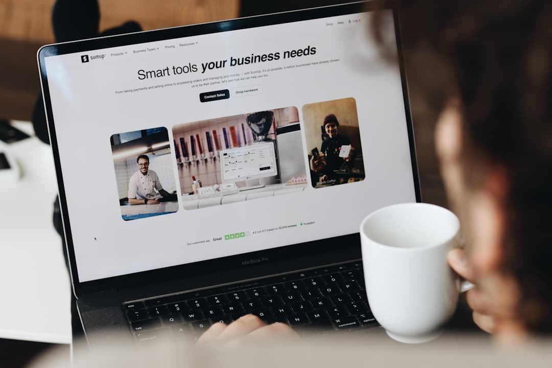 Small business owner building a website on a laptop