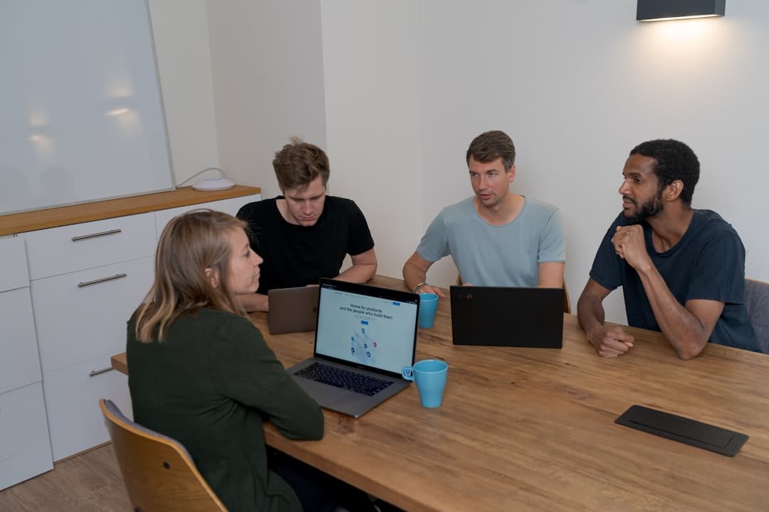 HR team reviewing a software dashboard