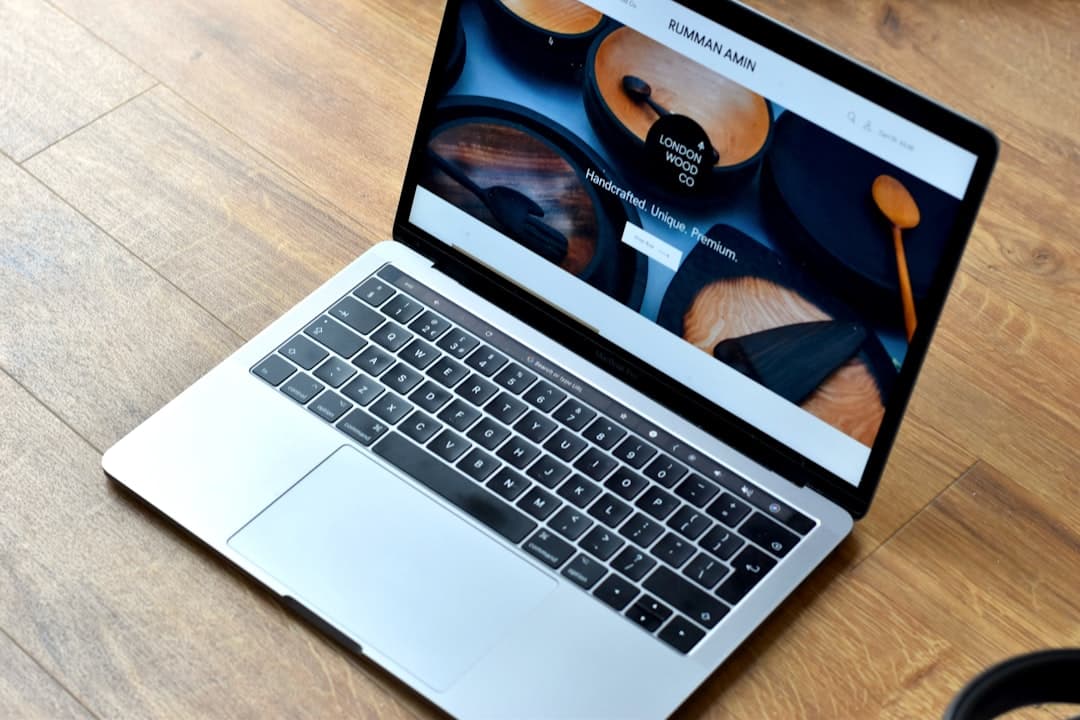 Developer maintaining a website on a laptop