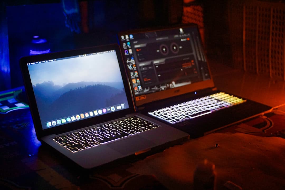 Wix vs Webflow website builder comparison on two laptops