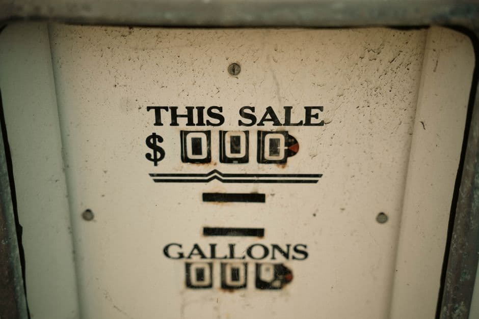 Close-up of an antique gas pump display showing price and gallons, vintage style.