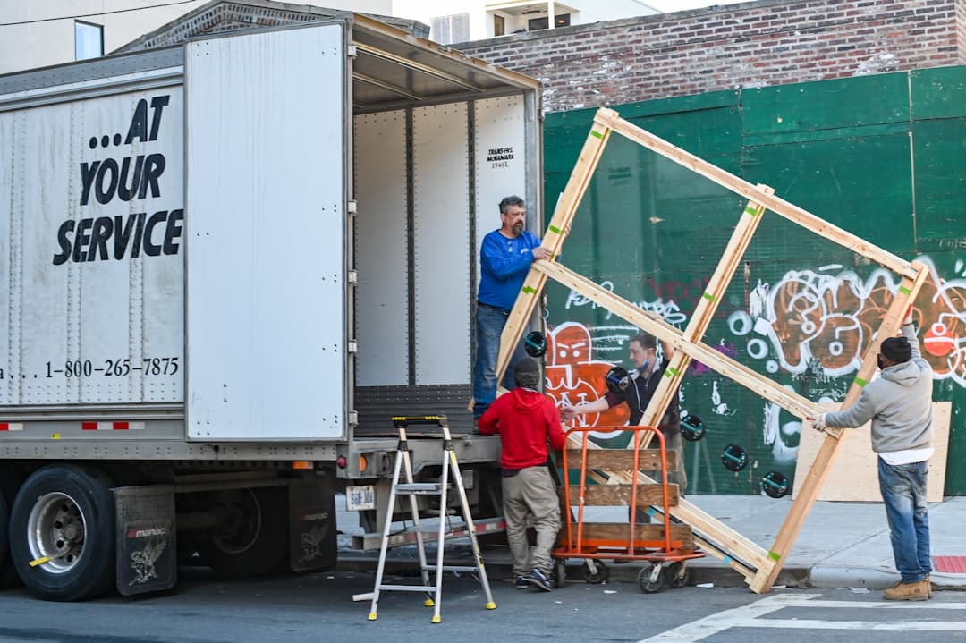 Moving company website design concept with moving boxes loaded into a truck