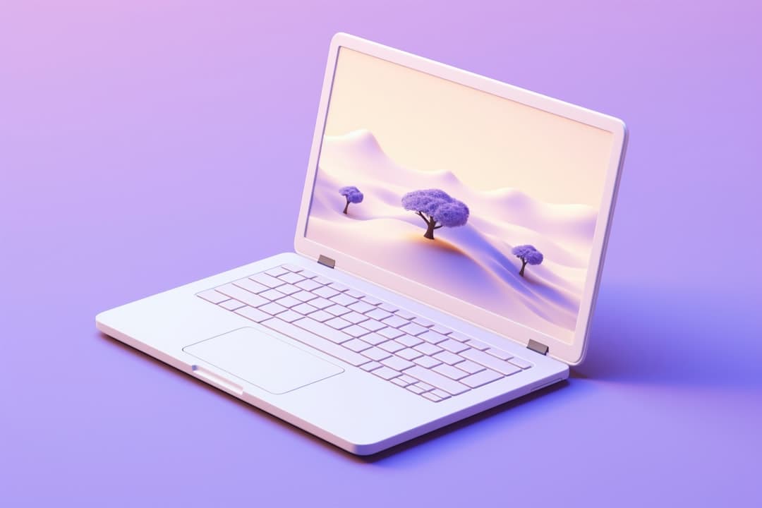 A white laptop shows a stylized purple landscape.