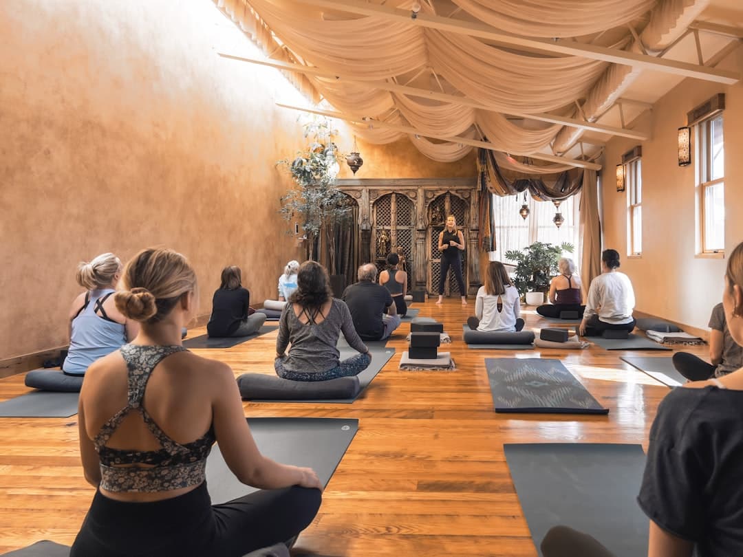 Calm yoga studio class illustrating yoga studio website design principles